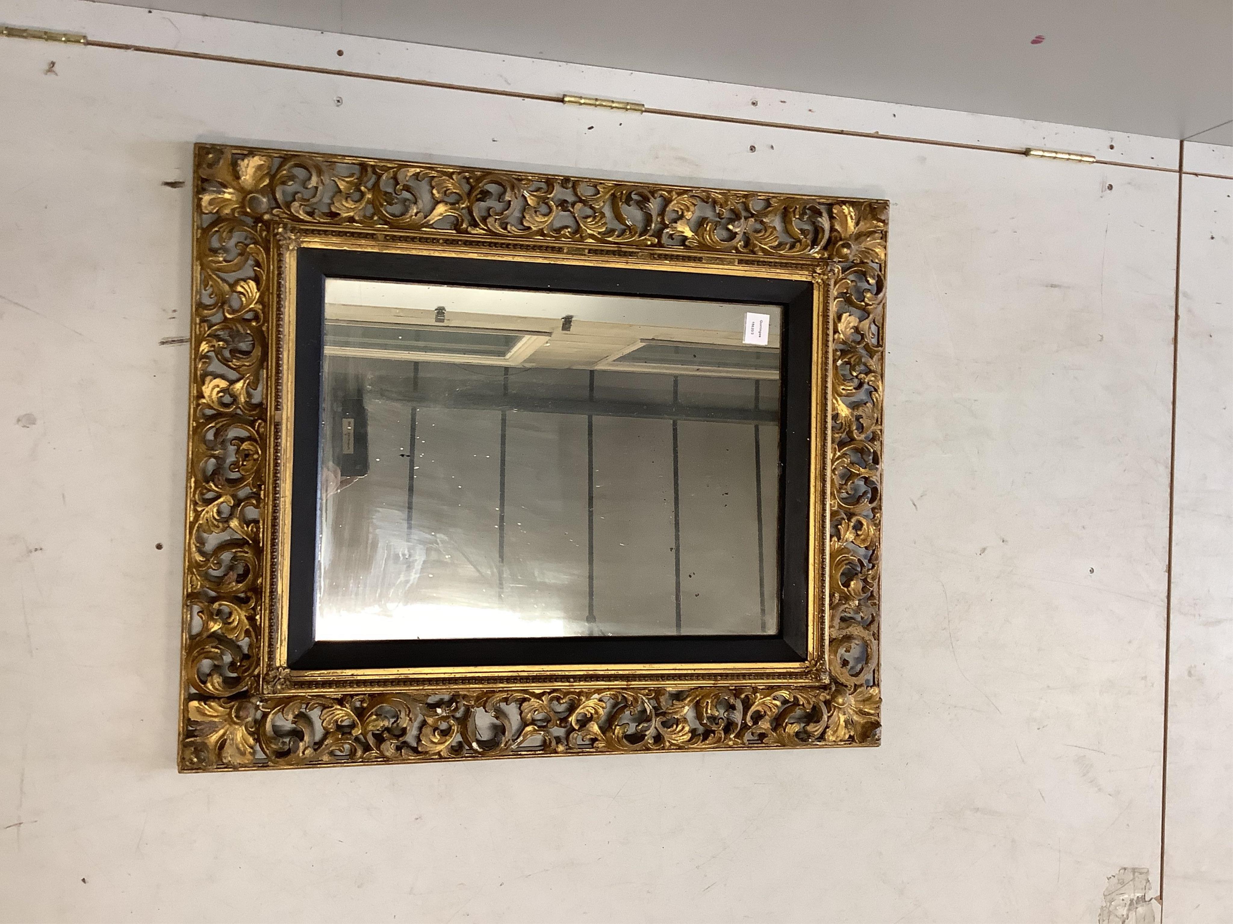 A Florentine style rectangular giltwood and composition wall mirror, width 74cm, height 90cm. Condition - fair